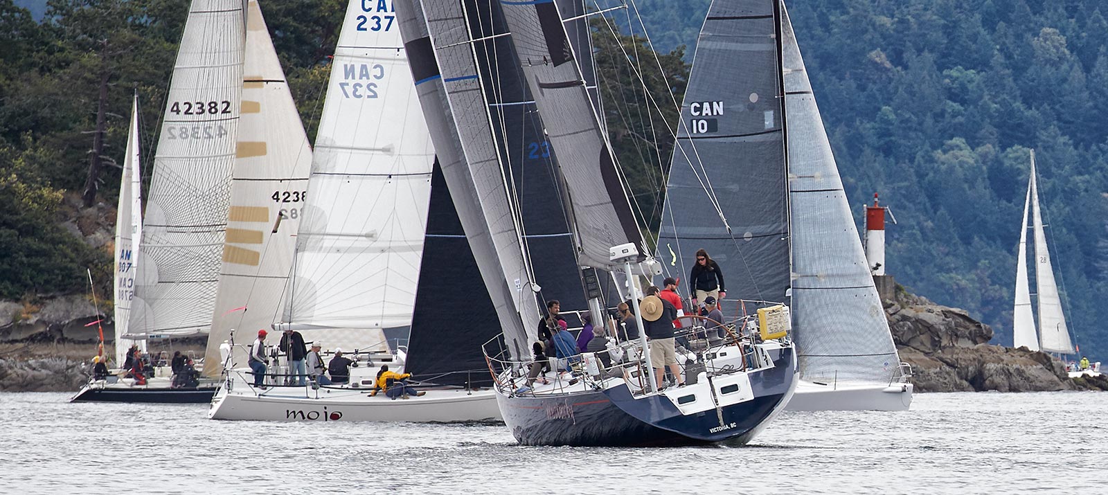 A few of the 100 Round Saltspring Island Race boats leave Ganges Harbour
